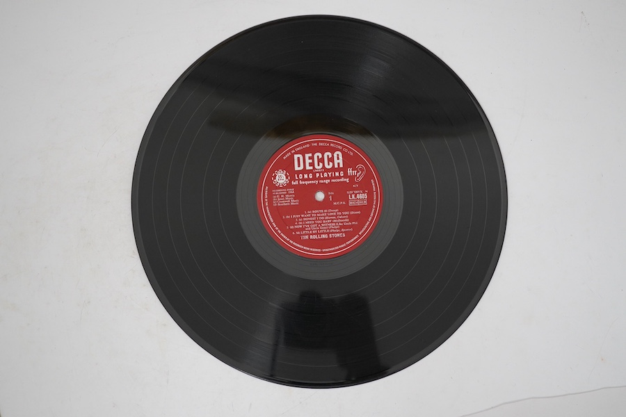 The Rolling Stones, first LP record album, on red Decca label, LK.4605, XARL-6271-1A XARL-6272-3A. Condition - fair to good, some surface scratches and general wear to the cover.